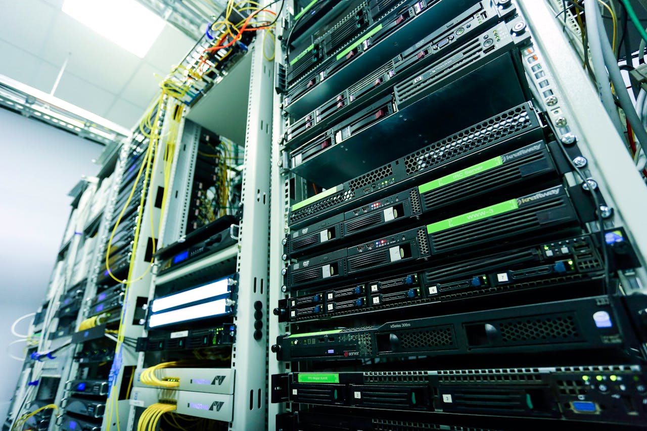 heros-img High-tech server rack in a secure data center with network cables and hardware components.